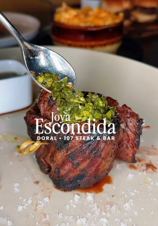 107 Steak & Bar in Doral showing review, visit, steak, mac n’ cheese with lobster, coconut shrimp, mini burgers, salmon tacos, pavlova, lunch special, video by hellentakesmiami on TikTok