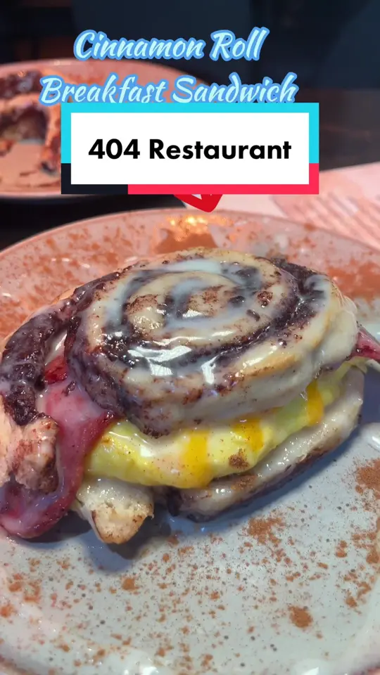 404 Restaurant & Bar in Atlanta showing review, visit, salmon brioche sandwich, cinnamon roll breakfast sandwich, ahlik’s skillet, grits, video by callmecandace.tv on TikTok