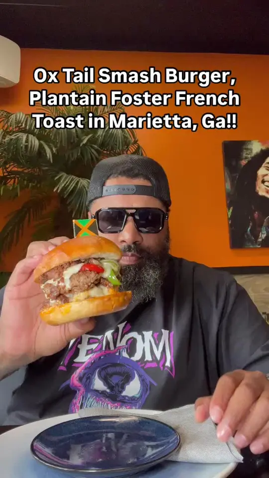 876 NyamMinz Jamaican Cuisine in Marietta showing jamaican food, oxtail birria tacos, curry chicken taco, jerk shrimp taco, oxtail burger, salmon burger, video by atlantafoodguy on TikTok