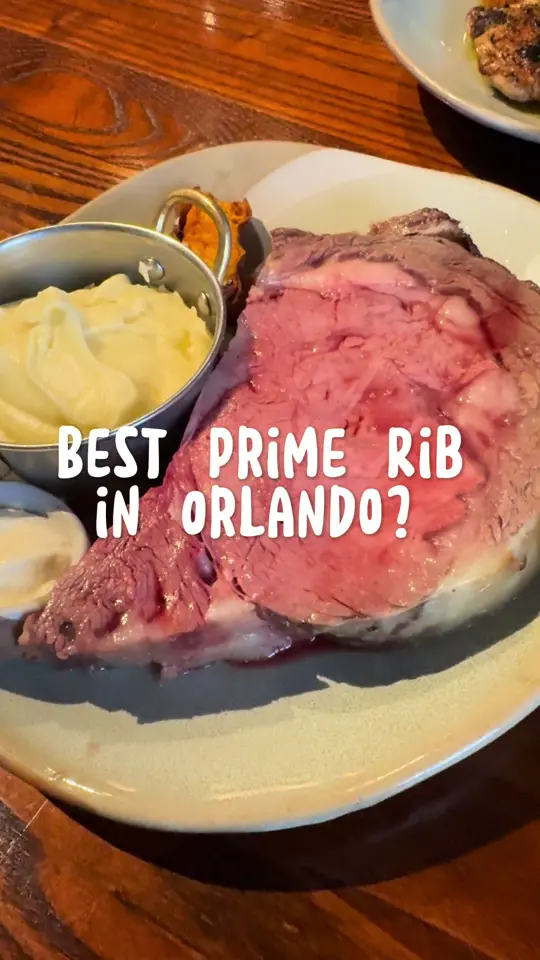 A Land Remembered in Orlando showing food, seared sea scallops, thick cut house smoked bacon, grass fed lamb chops, slow roasted prime rib, yellowfin tuna, joyce farms half chicken, banana caramel, video by tastychomps on TikTok