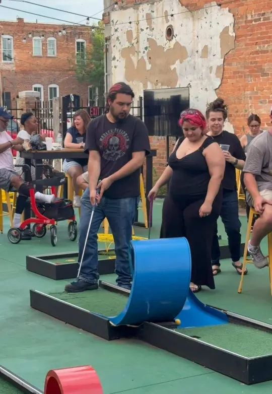 Affordable Gourmet in Griffin showing event, gourmet on the greens, minigolf bar atmosphere, video by puttandpour on TikTok