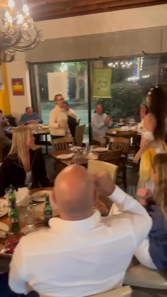 Agora Mediterranean Kitchen in West Palm Beach showing review, open kitchen, fresh ingredients, homemade sangria, cozy atmosphere, video by Clematis Street on Facebook