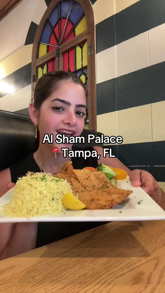AL Sham Palace in Tampa showing fried fish, fluffy rice, fresh veg, fattoush, video by al.sham.palace.tam on TikTok