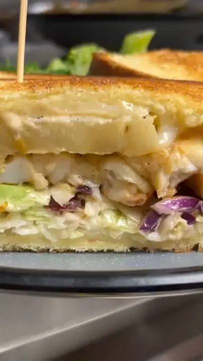 Alice Sweetwater's Bar & Grille in Naples showing food, lobster reuben, video by Alice Sweetwater's Bar & Grille on Facebook