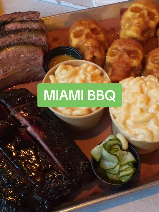 Apocalypse BBQ in Miami showing food, cafecito-rubbed ribs, skull-shaped cornbread, sauces with mojo and guava, chocolate chip cookies, video by concernedcook on TikTok