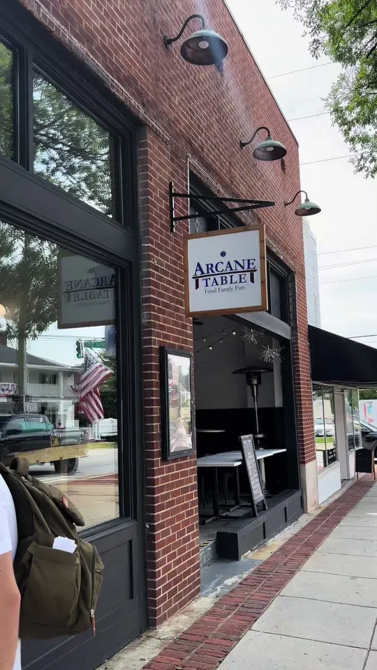 Arcane Table in Monroe showing food review, fried pickles, buffalo ranch, bacon jam burger, chicken strips, board games, trivia nights, karaoke, comedy shows, video by themundysfive on TikTok