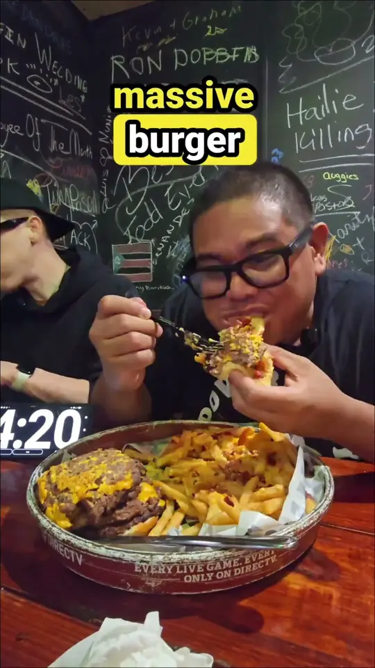 Auggie's Draft Room in St. Augustine showing giant burger challenge, video by Wayne Algenio on YouTube