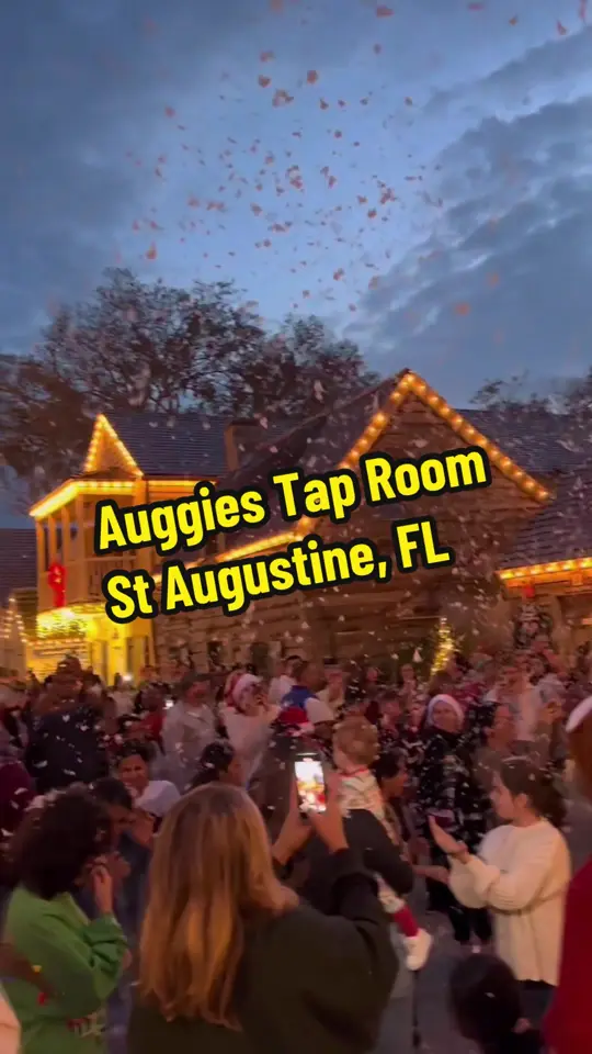 Auggie's Draft Room in St. Augustine showing bar, fake snow release, atmosphere, video by mytravelingappetite on TikTok