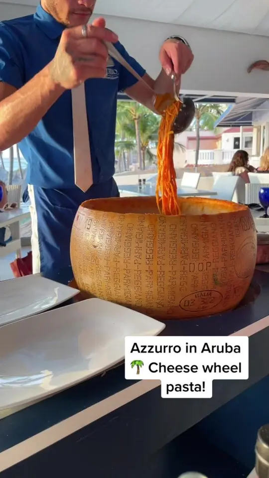Azzurro in Sunny Isles Beach showing cheese wheel pasta dish, video by ashleynewbegin on TikTok
