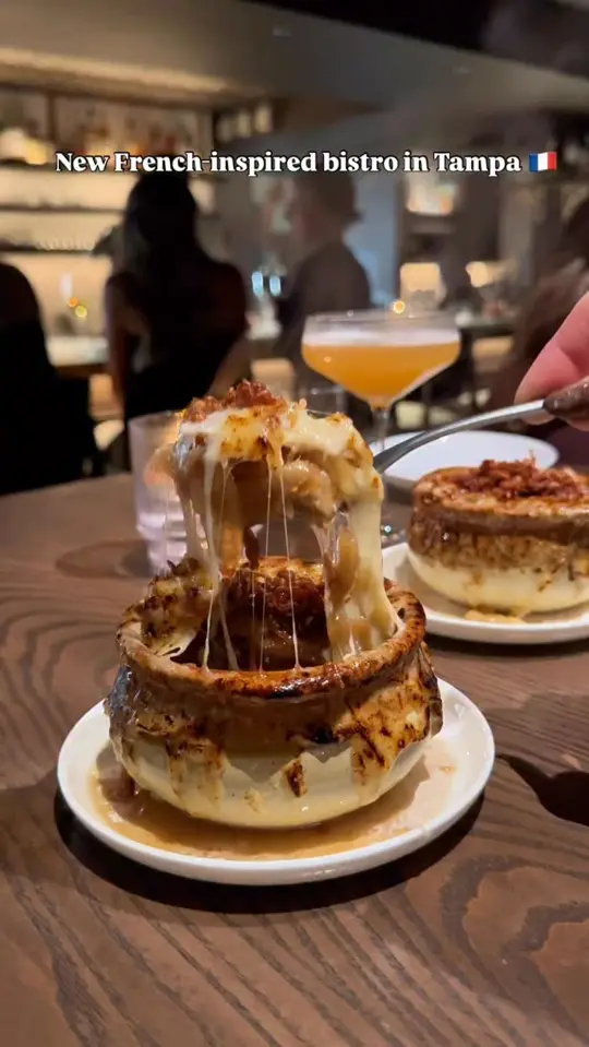 Bar Terroir in Tampa showing food, charcuterie tower, onion soup, baguette, gnocchi, desserts, video by When In Tampa on Facebook