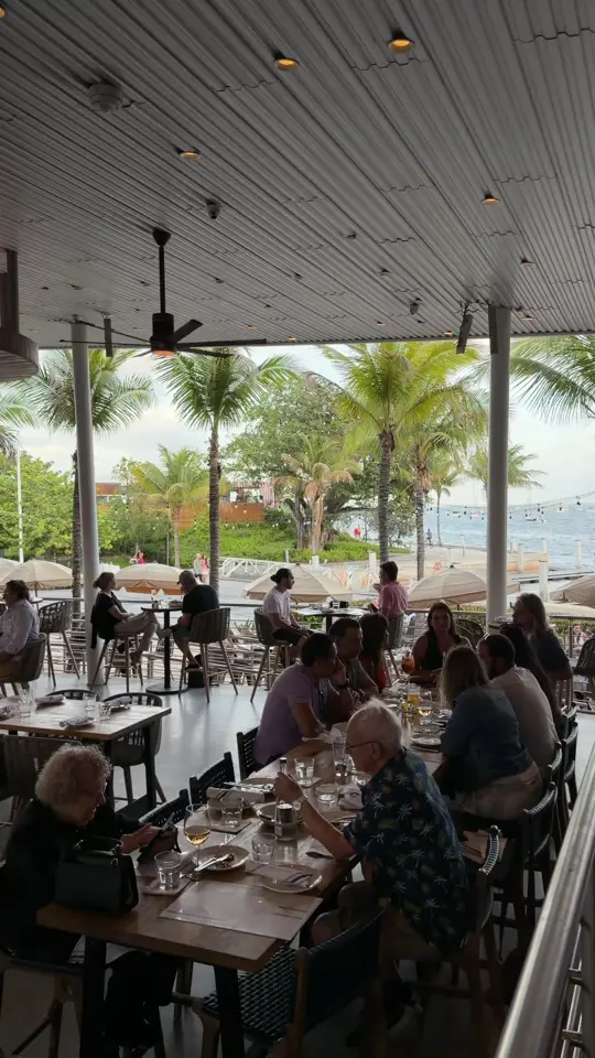 Bayshore Club Bar & Grill in Miami showing shrimp cocktail, waterfront views, atmosphere, video by .thefoode on TikTok