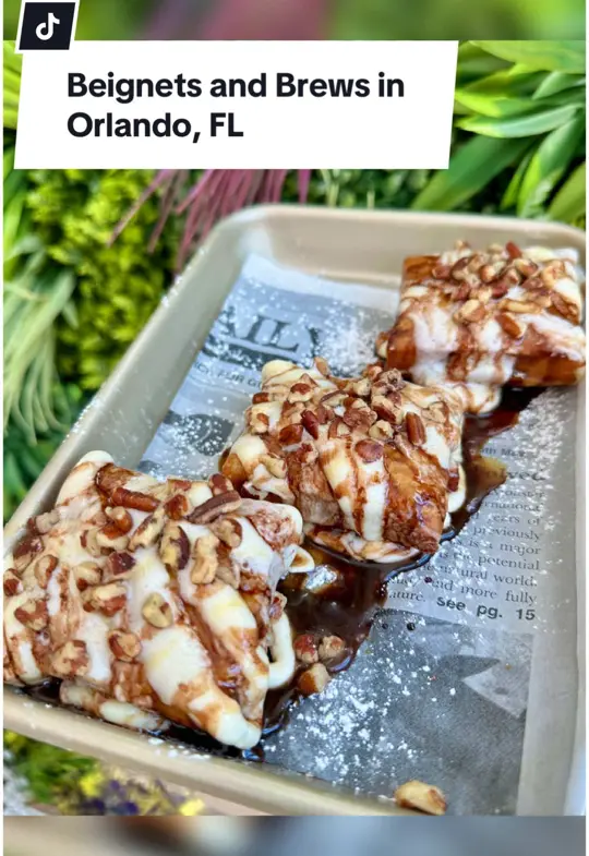 Beignets & Brew in Tallahassee showing review, visit, coffee, biscoff iced latte, food, beignets, video by christinainitalia on TikTok