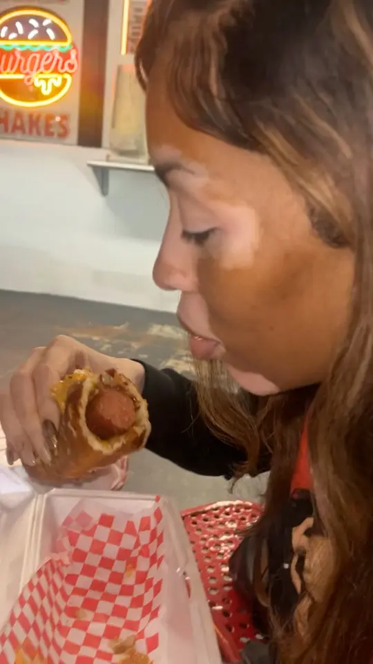 Big Mike's Burgers in New Smyrna Beach showing food, all beef hotdog, video by The Hughley’s on Facebook