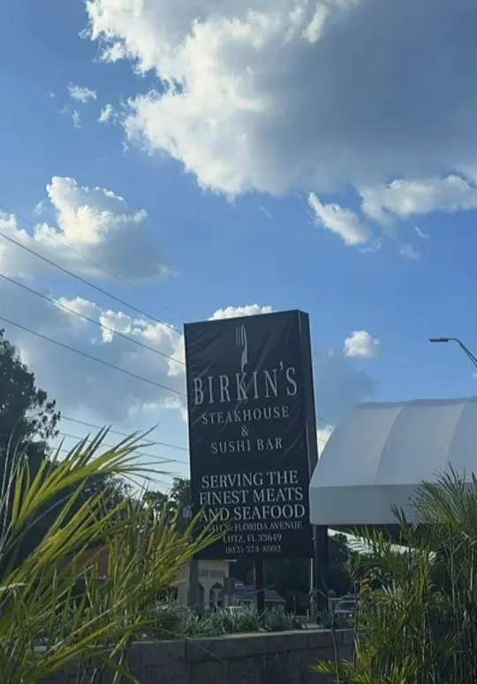 Birkin's Steakhouse and Sushi Bar in Lutz showing review, fresh baked bread, meatballs, shrimp tempura roll, porterhouse steak, surf n turf, garlic mash, creamed spinach, apple crumble, video by thejustinediaries on TikTok