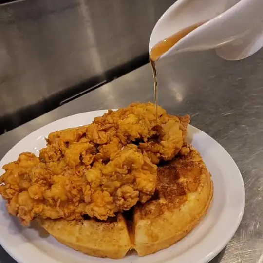 Bistro Hilary in Senoia showing food, hot chicken and waffle, video by Bistro Hilary on Facebook