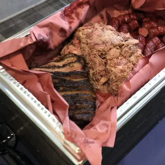 Blue Dog Craft Barbecue in Lakeland showing catering, food truck, brisket, pulled pork, ribs, sausage, video by Blue Dog Craft Barbecue on Facebook