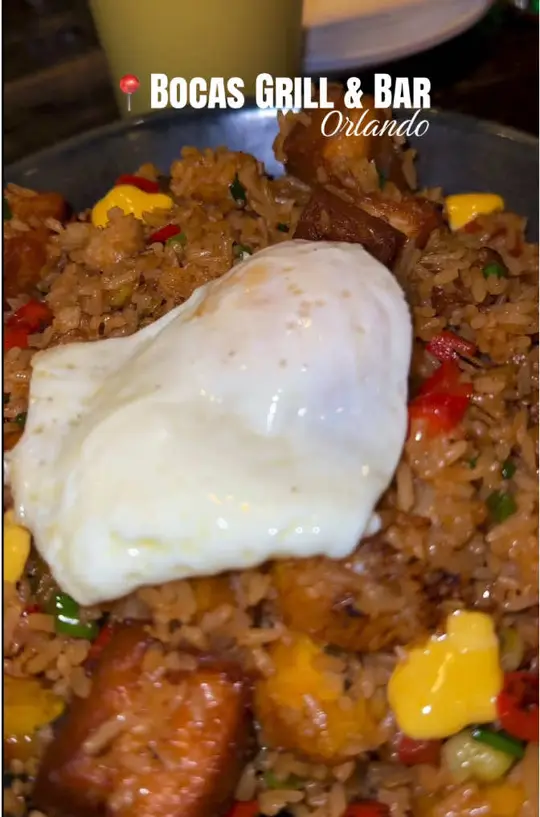 Bocas Grill Orlando in Orlando showing drinks, pineapple and mango juice, strawberry lemonade; appetizer, chicharrón bites; plates, porkbelly rice, simon bolivar tostones, video by _artofwisdom on TikTok