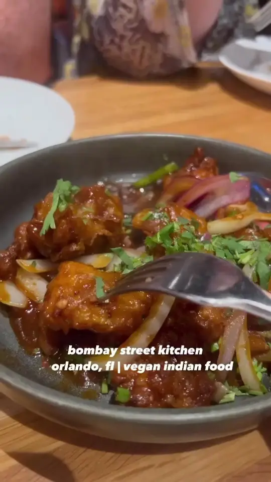 Bombay Street Kitchen in Orlando showing restaurant, vegan indian food, gobi manchurian, vegetable samosa, baigan mirchi ka salam, vegetable kurma, video by thesanfordvegan on TikTok