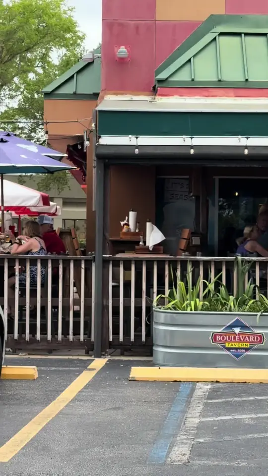 Boulevard Deli And Tavern in Fort Myers showing review, blackened chicken cesar wrap, french fries, bacon cheddar cheeseburger, onion rings, video by whatsupftmyers on TikTok