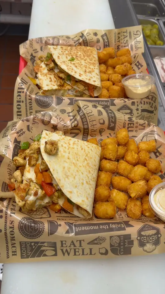 Brawlers Burgers & Wings in Newnan showing food, quesadillas, video by Brawlers Burgers and Wings on Facebook