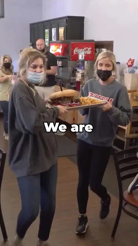 Brett's Casual American in Athens showing food challenge, burger, fries, video by Randy Santel on Facebook