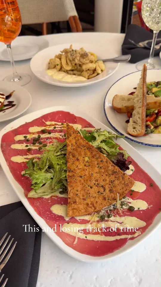Brio Italian Grille in Plantation showing happy hour, cocktail, wine, crispy calamari, carpaccio, tomato caprese, avocado caprese, video by Brio Italian Grille on Facebook