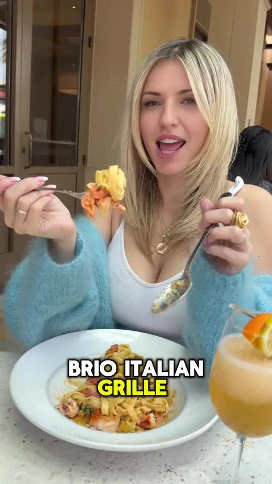 Brio Italian Grille in Tampa showing review, atmosphere, patio, wine, cocktails, steaks, chops, seafood, pasta, flatbreads, peach bellinis, shrimp & eggplant appetizer, video by thediningdolls on TikTok
