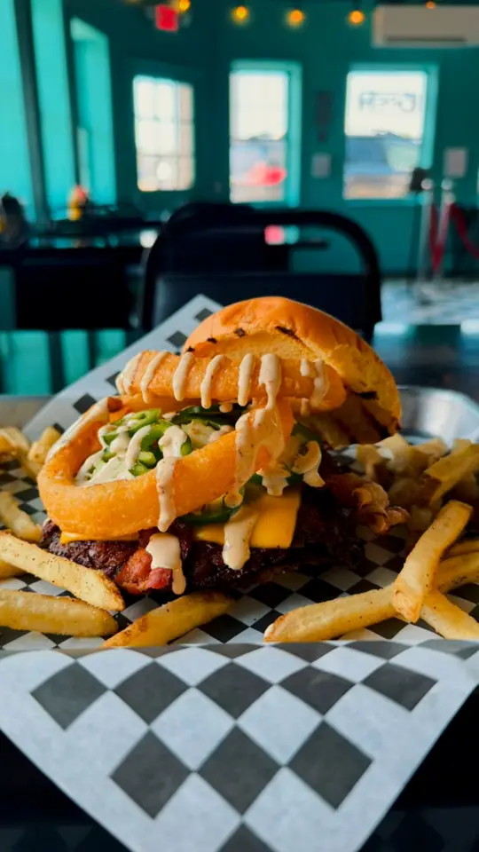 Bronco's in Hiawassee showing food, jalapeño popper burger, video by Bronco's Hiawassee on Facebook