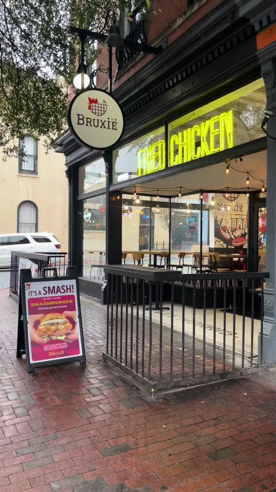 Bruxie in Athens showing chicken and waffles, waffle sandwiches, chicken tenders, custard shakes, video by oldsoultravelsandeats on TikTok