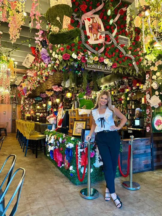  in Florida showing alice in wonderland-themed pop-up bar, immersive experience, themed menus, whimsical décor, creative cocktails, burgers, tacos, waffles, video by Marley Capper TV on Facebook