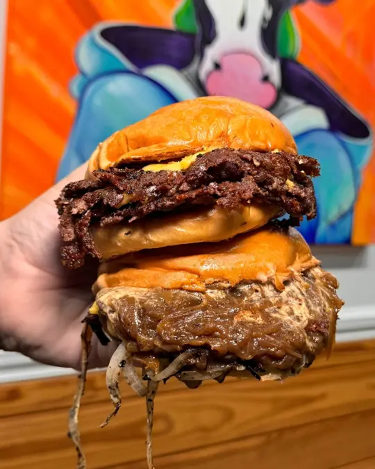 Burger U in Orlando showing food, smash burger, video by Visit Orlando on Facebook