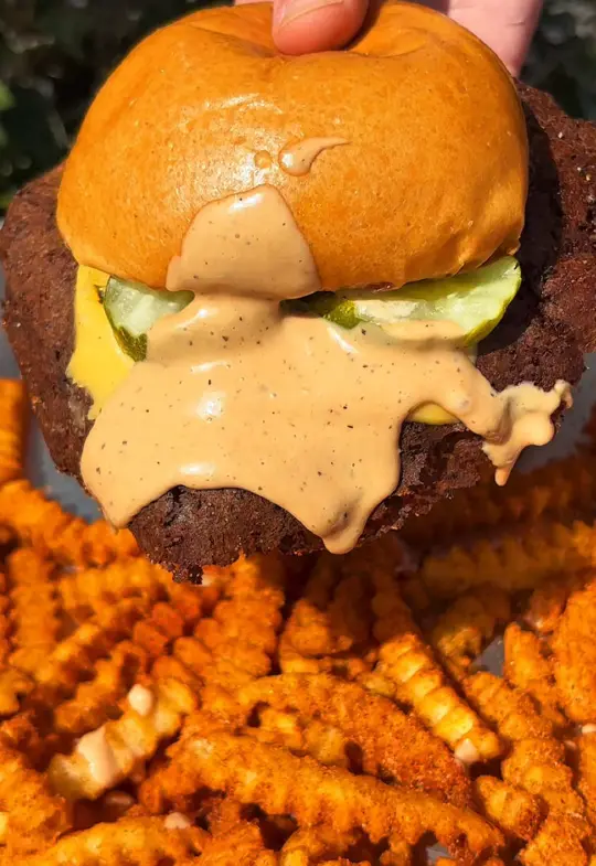 Burger U in Orlando showing food, smash burgers, cc sauce, video by eatcowandcheese on TikTok