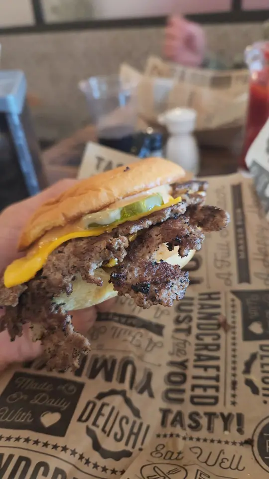 Burgerrobs in Titusville showing review, visit, fries, chili cheese fries, buffalo bacon ranch, video by Village Food Tours on Facebook