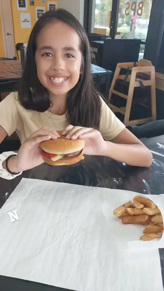 Burny Pit Stop in Jensen Beach showing food, kid's burger, video by Burny Pit Stop on Facebook
