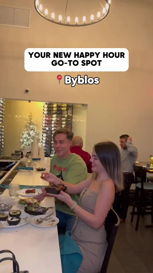 Byblos in Tampa showing happy hour, 2 for 1 drinks, discounted bites, 80’s themed disco new year’s eve party, video by foodbytiana on TikTok