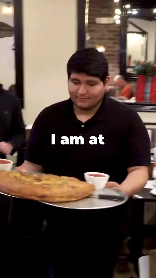 Café Panuzzo's in Oviedo showing food challenge, italian calzone, video by Randy Santel on Facebook