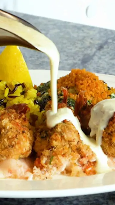 Cafe Blue in Austell showing food, crab stuffed jumbo gulf shrimp, video by Cafe Blue on Facebook