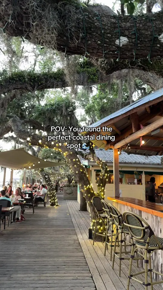 Cap's On the Water in St. Augustine showing review, visit, sunset views, outdoor dining deck, coastal cuisine, video by brugiamariani on TikTok