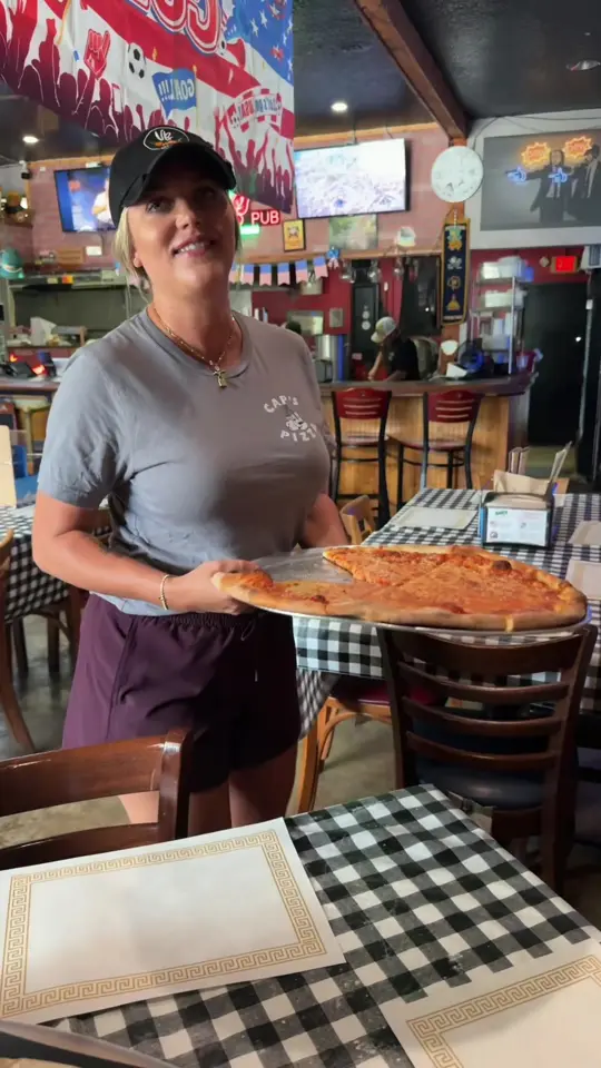 Cap's Pizza & Pub in Vero Beach showing visit, pizza, video by capspizzaverobeach on TikTok