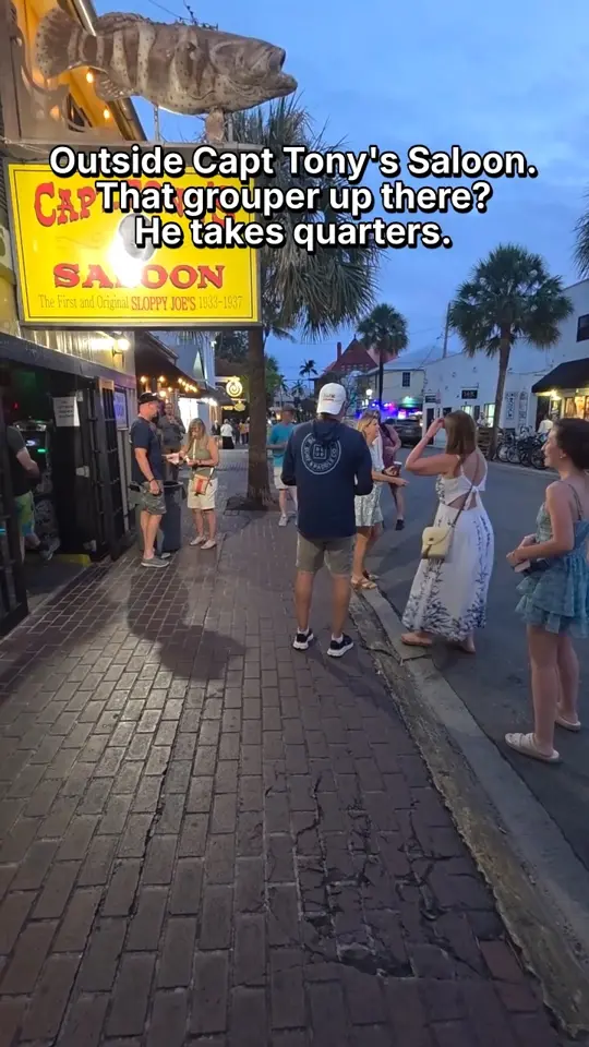 Capt Tony’s Saloon in Key West showing atmosphere, quarter toss tradition, grouper mount, video by Florida Keys Resorts on Facebook