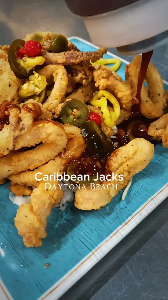 Caribbean Jack's in Daytona Beach showing restaurant, tiki bar, waterfront views, island vibe, video by Caribbean Jack's Restaurant & Tiki Bar on Facebook