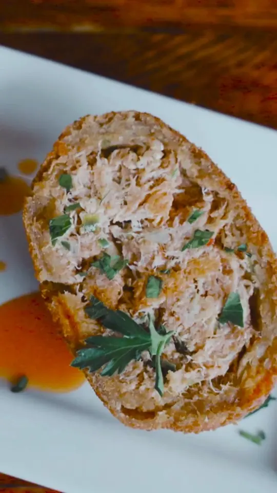 Carmine's Restaurant & Bar - Ybor in Tampa showing deviled crab, blue crab meat, video by Carmine's Ybor on Facebook
