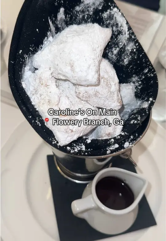 Caroline's on Main in Flowery Branch showing review, visit, food, butter fried banana bread with whipped cream and maple syrup, beignets with chocolate ganache, avocado toast with over easy eggs and crispy, video by jessjustate on TikTok