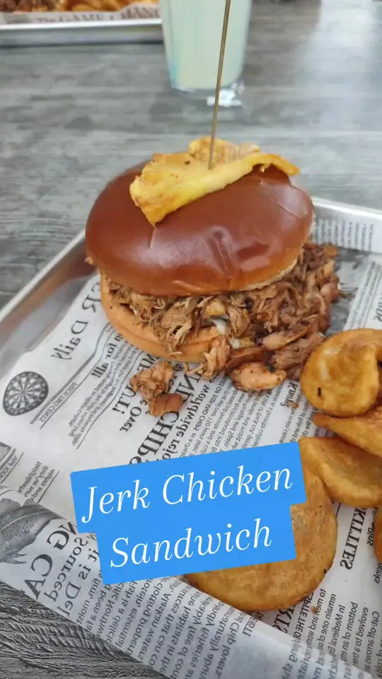Casino Beach Bar & Grille in Pensacola Beach showing food, jerk chicken sandwich, video by justdreadenise on TikTok