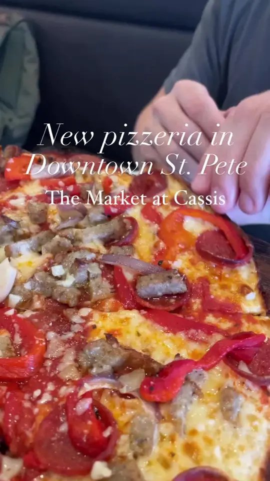 Cassis in St. Petersburg showing pizzeria, to-go cafe, handmade pies, pizza by the slice, sandwiches, salads, baked goods, ice cream, coffee service, beers, wines, juices, video by ilovetheburgstpete on TikTok