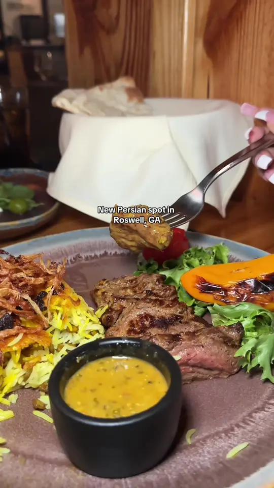 Chelo in Roswell showing food, feta cheese rolls, grilled prawns, chenjeh with adas polo rice, video by sydwalker5 on TikTok