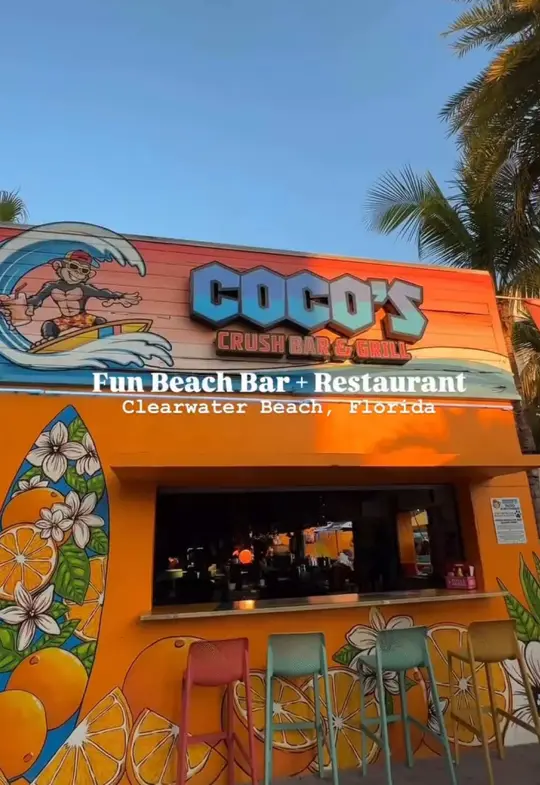 Coco's Crush Bar & Grill in Indian Rocks Beach showing review, visit, crab legs, crab dip, bbq pork nachos, coco’s crush, mango piña colada, live music, video by guidedbydestiny on TikTok