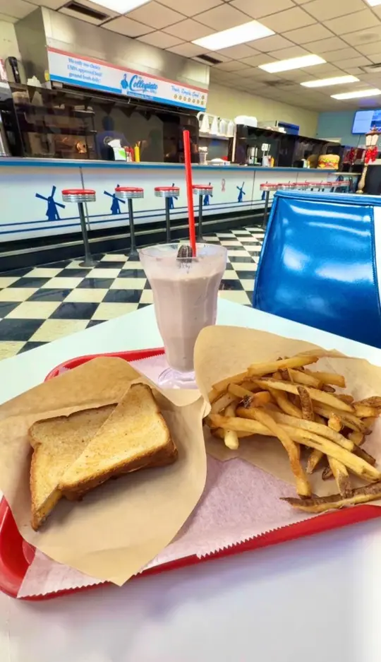 Collegiate Grill in Gainesville showing burger, hot dog, fries, milkshake, diner atmosphere, video by Mountains and Main on Facebook