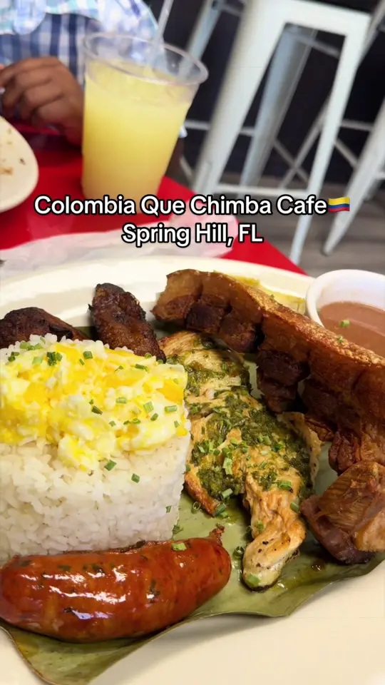 Colombia Que Chimba Café in Spring Hill showing food, bandeja paisa, lunch specials, steak, chicken, buñuelo, passion fruit juice, mango juice, video by kikilalala20 on TikTok