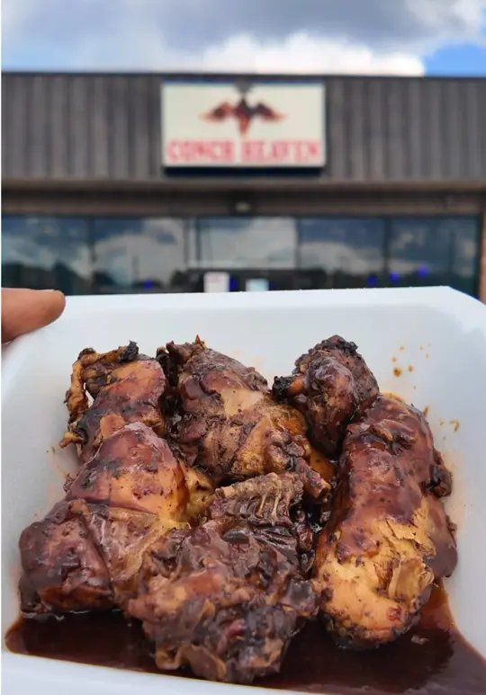 Conch Heaven in Atlanta showing food, jerk chicken, johnny cake, video by westbrookeats on TikTok